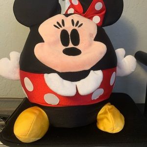Stuffed Minnie Mouse animal that sits on its own.